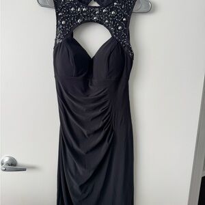 Elegant Blue Sleeveless Dress with Embellished Neckline